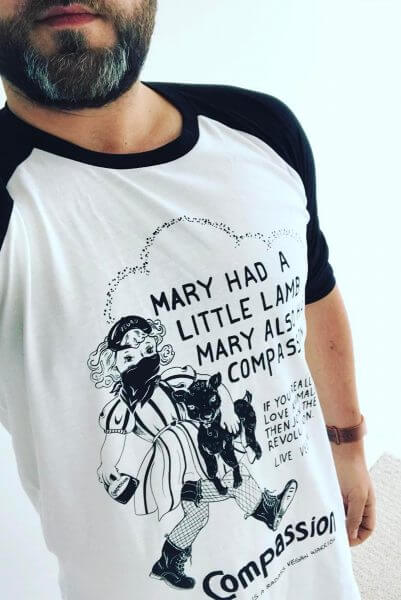 A close up picture of a man wearing one of Eco-ethical brand Viva La Vegan's Mary Had a little lamb.