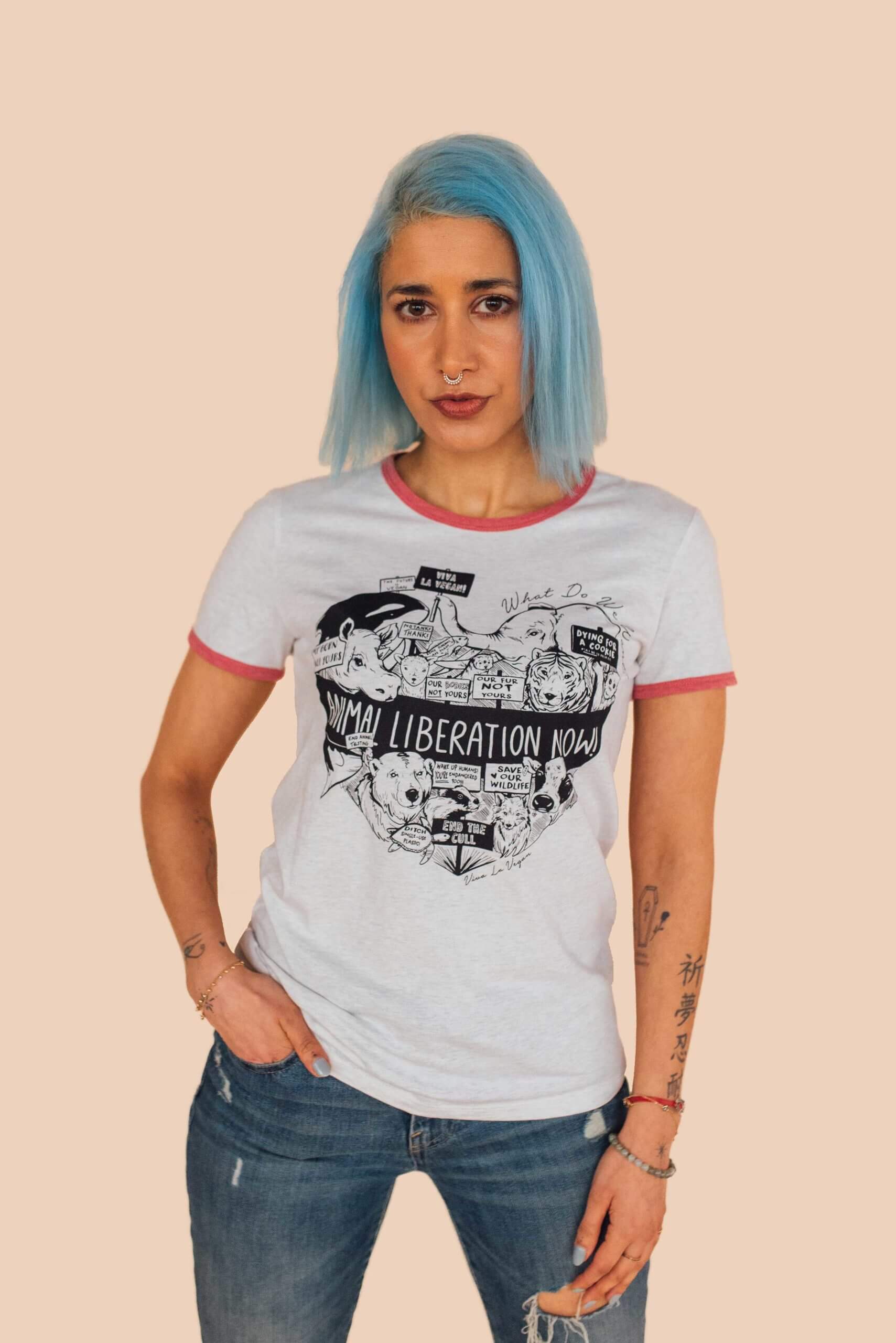 Model standing and showcasing the Eco-Ethical brand Viva La Vegan's white Animal Liberation Tshirt