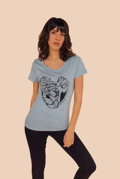 Vegan female model wearing blue organic tshirt with adopt dont shop statement graphic