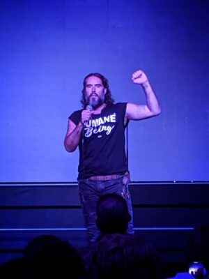 A picture of Russel Brand wearing Viva La Vegan Humane Being T-shirt