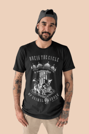 Male Model wearing a Unisex Tshirt in black that has grapghic design and word relating to breaking the cylcle of animal abuse.