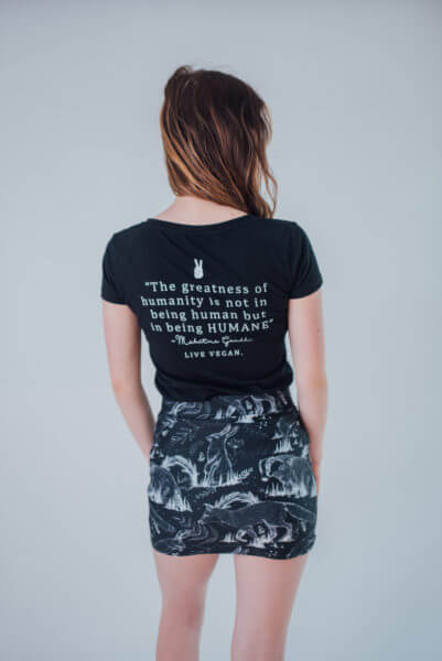 Vegan Model wearing all over animal print skirt back view