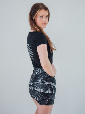 Vegan Model Wearing All over Animal print skirt side view