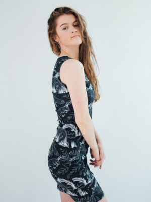 Vegan Model wearing wildlife dress side view