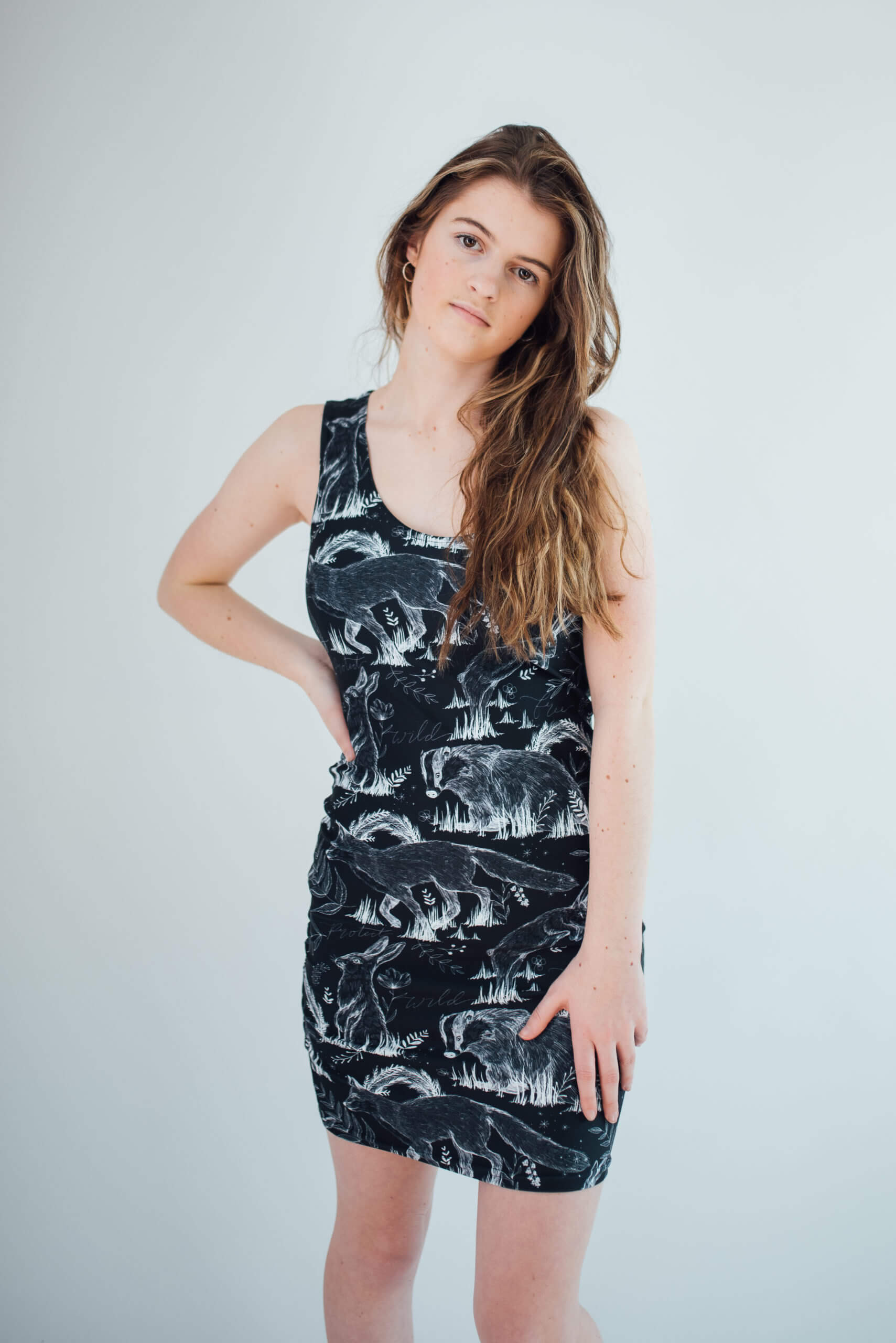 Vegan Model Angel wearing all over print wildlife dress