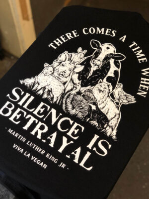 Detailed display of vegan Tshirt graphics. Silence equals violence print detail