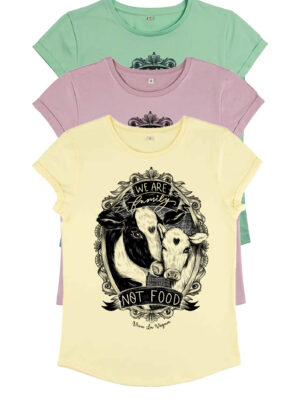A picture of three pastel coloured organic vegan t-shirts layered on top of each other with top t-shirt showing graphics of a cow and her calf with the word Family not Food. Tshirts designed by eco ethical brand Viva La Vegan.