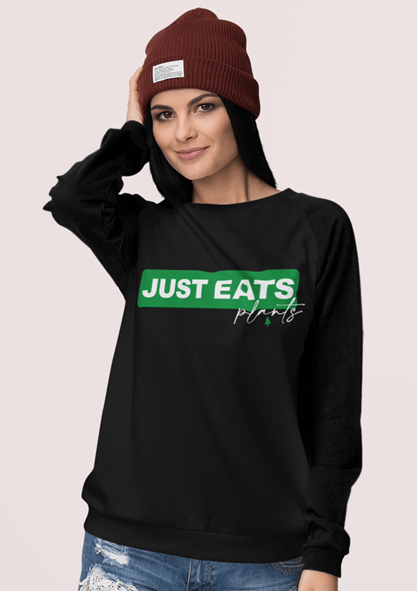 Girl with long dark hair wearing a black Only Eats Plants sweatshirt by eco-ethical brand Viva La Vegan