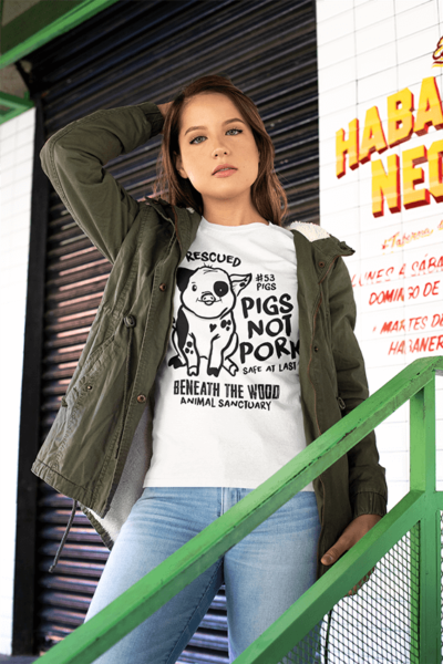 Woman with dark hair wearing a white Pigs not pork tshirt by viva la vegan