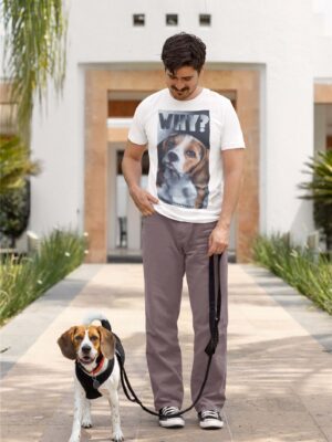 Man walking a beagle wearing brown trousers and a white shirt with a large painted beagle design with the word WHY. By Viva La Vegan