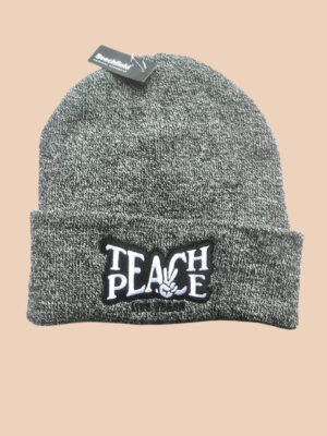 Flatlay photo of a cuffed beanie in grey heather colour with a black and white embroidery 'Teach Peace - Live Vegan.