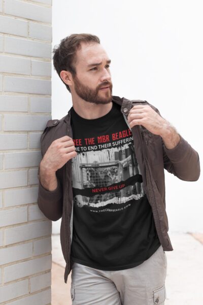 Bearded man wearing a black tshirt with a red & white torso print. A black & white photo of beagle puppies being transported in a trolley. text Never give up.